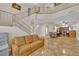 Expansive living room featuring tile floors, two story ceilings and an open layout at 6536 Castor Tree Way, Las Vegas, NV 89108