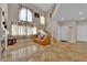 Cozy living room boasting tile floors, a fireplace, and a staircase at 6536 Castor Tree Way, Las Vegas, NV 89108