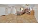 Open-concept living area featuring tile flooring and abundant natural light at 6536 Castor Tree Way, Las Vegas, NV 89108
