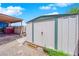 View of a storage shed in the backyard providing secure and ample storage at 6536 Castor Tree Way, Las Vegas, NV 89108