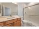 Modern bathroom features a glass enclosed shower and vanity with framed mirror above at 89 Oratorio Dr, Henderson, NV 89015