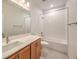 Bright bathroom features a large vanity, a tub-shower, and tiled floors at 89 Oratorio Dr, Henderson, NV 89015