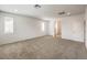 Large carpeted bedroom with recessed lighting and an ensuite bath at 89 Oratorio Dr, Henderson, NV 89015