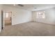 Spacious carpeted bedroom featuring natural lighting and a large doorway at 89 Oratorio Dr, Henderson, NV 89015