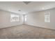 Spacious bedroom featuring neutral carpeting, recessed lighting, and abundant natural light at 89 Oratorio Dr, Henderson, NV 89015