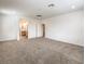 Large carpeted bedroom with recessed lighting and an ensuite bathroom at 89 Oratorio Dr, Henderson, NV 89015