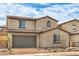 Charming two-story home with a tile roof, paved driveway, and attached two-car garage at 89 Oratorio Dr, Henderson, NV 89015