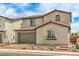 Beautiful two-story home with a neutral color palette, tile roof, and low maintenance landscaping at 89 Oratorio Dr, Henderson, NV 89015