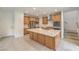 Well-equipped kitchen features stainless steel appliances and a large center island with sink at 89 Oratorio Dr, Henderson, NV 89015