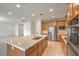 Spacious kitchen featuring stainless steel appliances and an island with quartz countertops at 89 Oratorio Dr, Henderson, NV 89015