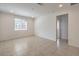 Bright and airy living room featuring tile flooring, recessed lighting, and a large window at 89 Oratorio Dr, Henderson, NV 89015