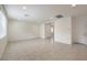 Bright living room featuring tile floors and ample natural light from large windows at 89 Oratorio Dr, Henderson, NV 89015
