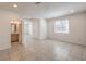 Spacious living room showcasing tile floors, recessed lighting, and seamless flow to other spaces at 89 Oratorio Dr, Henderson, NV 89015