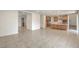 Open-concept living space with tile floors flows into the kitchen, with lots of room for entertaining at 89 Oratorio Dr, Henderson, NV 89015