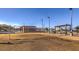 Outdoor volleyball court surrounded by seating areas, playground and walking path at 89 Oratorio Dr, Henderson, NV 89015