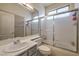 Bathroom featuring a combination shower and tub with a glass enclosure, and sink at 8942 Galena Crossing St, Las Vegas, NV 89123