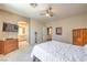Bright bedroom with a ceiling fan and an archway leading to the en-suite bathroom at 8942 Galena Crossing St, Las Vegas, NV 89123