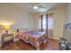 Bedroom with hardwood floors, ceiling fan and window, and a queen-sized bed at 8942 Galena Crossing St, Las Vegas, NV 89123