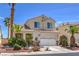 Charming two-story home with a well-manicured front yard, mature palm trees, and a two-car garage at 8942 Galena Crossing St, Las Vegas, NV 89123