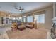 Open-concept living area features a cozy fireplace and comfortable seating in neutral colors at 8942 Galena Crossing St, Las Vegas, NV 89123