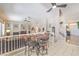 Open-concept living area with a fireplace, neutral colors, and staircase at 8942 Galena Crossing St, Las Vegas, NV 89123