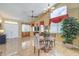 Bright living room featuring tiled floors, neutral walls, stylish furnishings, and large windows at 8942 Galena Crossing St, Las Vegas, NV 89123