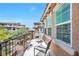 Cozy balcony with outdoor seating that provides a relaxing view of the neighborhood at 9981 Sable Point St, Las Vegas, NV 89178