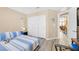 Serene bedroom featuring sliding door closet, neutral tones, and comfortable furnishings, creating a peaceful retreat for rest and relaxation at 9981 Sable Point St, Las Vegas, NV 89178