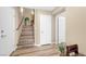 Open entryway featuring hardwood floors, staircase, and ample natural light at 9981 Sable Point St, Las Vegas, NV 89178