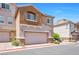 Charming two-story townhome with a two-car garage, neutral color palette, and inviting curb appeal at 9981 Sable Point St, Las Vegas, NV 89178