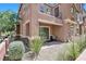 Exterior shot of a stylish home, featuring a private patio and beautiful landscaping at 9981 Sable Point St, Las Vegas, NV 89178