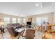 Spacious living room with hardwood floors, a ceiling fan, and plenty of natural light at 9981 Sable Point St, Las Vegas, NV 89178