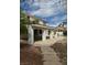 View of backyard with extended covered patio and partial view of pool and blue sky at 1003 Dover Glen Dr, North Las Vegas, NV 89031