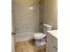 Bathroom featuring a shower, toilet, and white marble tile at 1003 Dover Glen Dr, North Las Vegas, NV 89031
