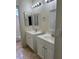 Bathroom featuring double sinks with modern fixtures and ample cabinet space at 1003 Dover Glen Dr, North Las Vegas, NV 89031