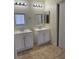 Bathroom featuring a dual vanity and tiled floor at 1003 Dover Glen Dr, North Las Vegas, NV 89031