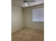 A sunny bedroom with a ceiling fan and a bright window at 1003 Dover Glen Dr, North Las Vegas, NV 89031
