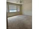 Expansive bedroom with a ceiling fan and multiple windows at 1003 Dover Glen Dr, North Las Vegas, NV 89031