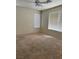 Cozy bedroom with wall-to-wall carpet and a ceiling fan at 1003 Dover Glen Dr, North Las Vegas, NV 89031