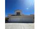 Two-story home featuring a three-car garage and a terracotta-tile roof at 1003 Dover Glen Dr, North Las Vegas, NV 89031
