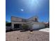 Charming two-story home with a three-car garage and well-manicured landscaping at 1003 Dover Glen Dr, North Las Vegas, NV 89031