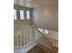 High-ceiling foyer featuring a stairway with white railing and a view of the entryway at 1003 Dover Glen Dr, North Las Vegas, NV 89031