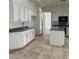 Spacious kitchen with modern white cabinets and an island at 1003 Dover Glen Dr, North Las Vegas, NV 89031
