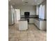 Spacious kitchen with modern white cabinets and an island at 1003 Dover Glen Dr, North Las Vegas, NV 89031