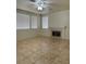 Cozy living room featuring tile floors and a fireplace at 1003 Dover Glen Dr, North Las Vegas, NV 89031
