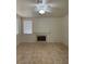 Cozy living room featuring tile floors and a fireplace at 1003 Dover Glen Dr, North Las Vegas, NV 89031