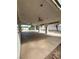 View of large, open back patio with a vaulted ceiling, pillars, ceiling fans, and a view to the backyard at 1003 Dover Glen Dr, North Las Vegas, NV 89031