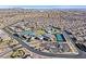 Primary-planned community aerial showcasing tennis courts, clubhouse, pool, manicured landscaping and neighborhood amenities at 10150 Emerald Sunset Ct, Las Vegas, NV 89148