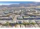 Stunning aerial view of a well-planned community nestled against a scenic mountain backdrop at 10150 Emerald Sunset Ct, Las Vegas, NV 89148