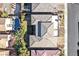 Aerial view showcasing a home with a pool, manicured lawn, and outdoor entertaining spaces in a residential neighborhood at 10150 Emerald Sunset Ct, Las Vegas, NV 89148